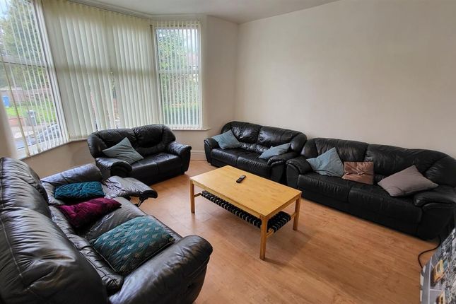 Bright And Comfortable Living Room Featuring Ample...