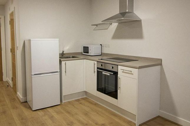 Modern Kitchen Featuring Sleek Cabinetry And Appli...