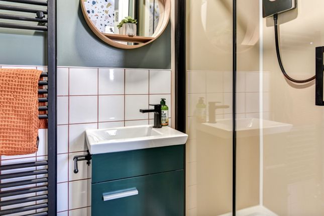 This Stylish Bathroom Features A Sleek Shower And ...