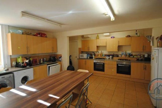 A Spacious And Well-Organized Kitchen With Ample c...