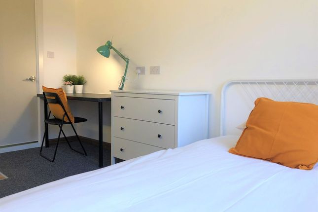 A Neat And Functional Single Bedroom Featuring A c...