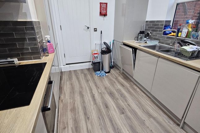 Modern And Clean Kitchen Area With Ample Counter S...