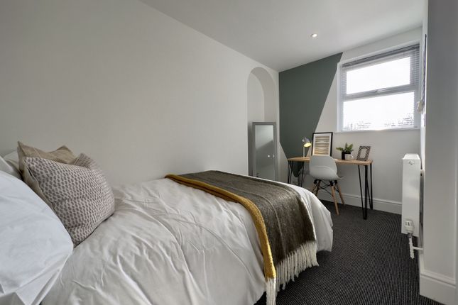 A Bright And Tidy Double Bedroom Featuring A Cozy ...