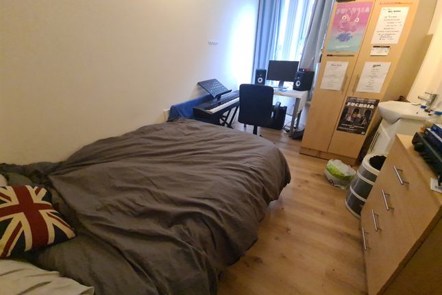 Cozy Single Bedroom Featuring A Comfortable Bed Wi...