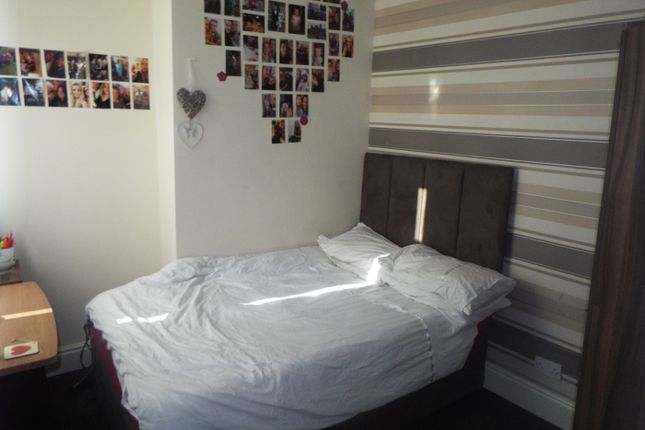 This Inviting Double Bedroom Features A Cozy Bed, ...