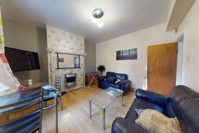 Bright And Inviting Living Room Featuring Comforta...