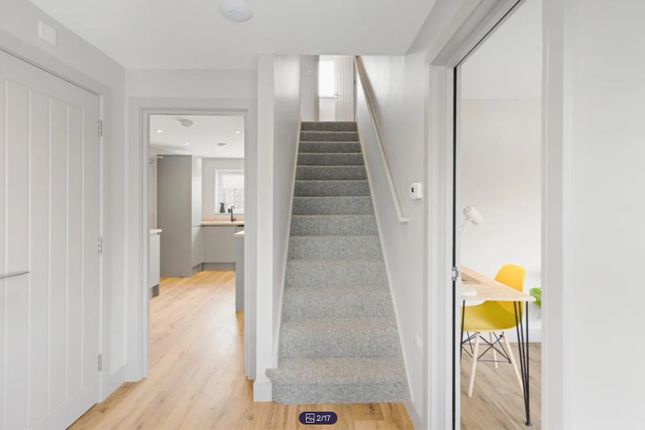 A Bright And Clean Hallway Leading To Various Room...
