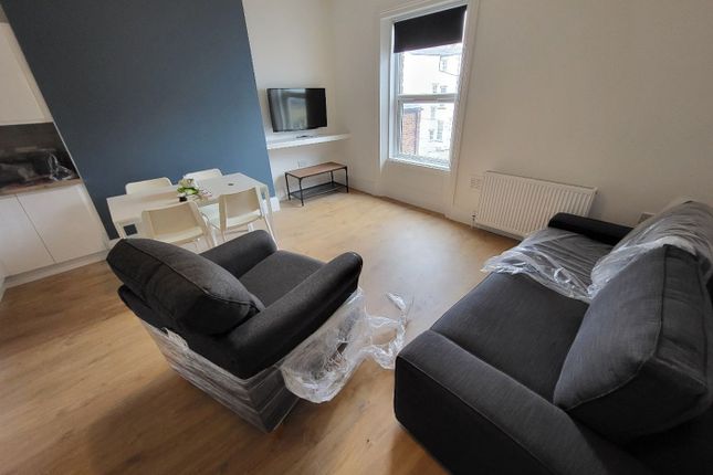 A Bright And Modern Living Room Featuring Stylish ...