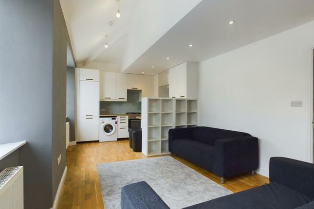 A Spacious And Modern Living Room With Ample Natur...