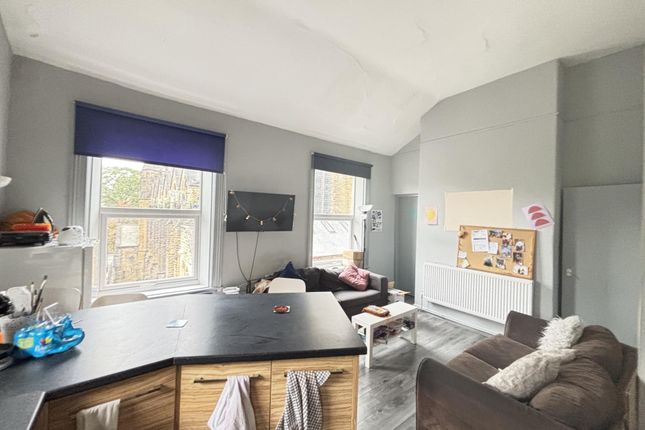 A Well-Lit And Modern Living Room Featuring Large ...