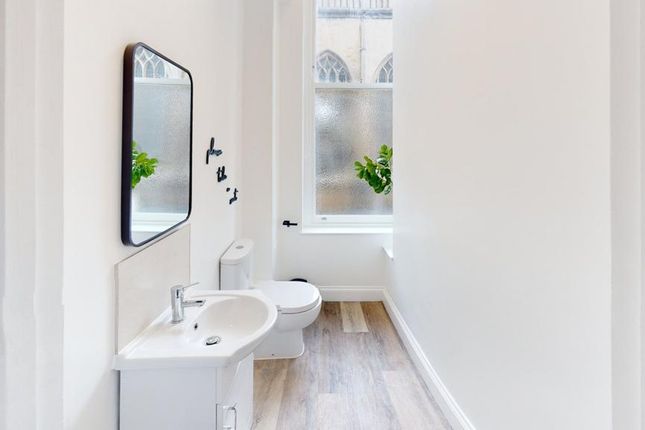 A Bright And Clean Bathroom Featuring Modern Fixtu...