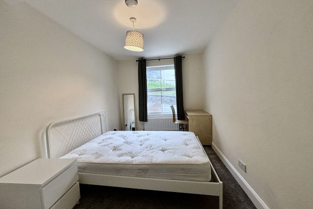 A Spacious And Bright Double Bedroom Featuring A S...
