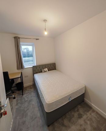 A Neat And Modern Double Bedroom Featuring A Comfo...