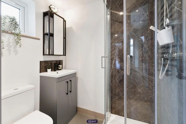 A Modern And Stylish Bathroom Featuring A Sleek Sh...