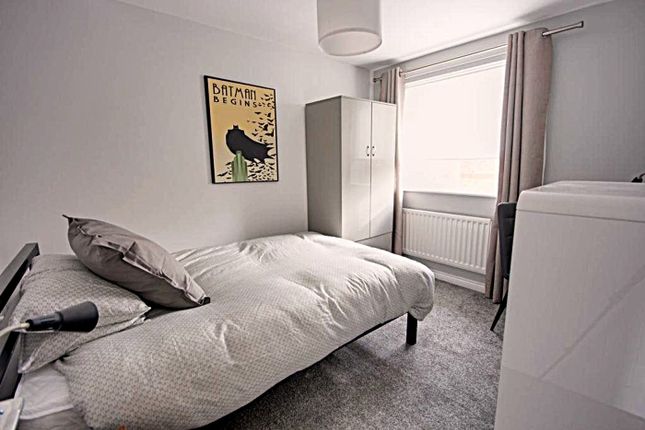A Bright And Inviting Double Bedroom Featuring A c...