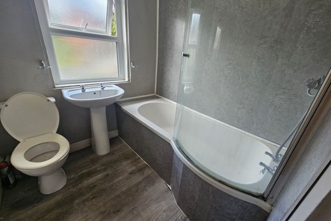 A Clean, Well-Maintained Bathroom Featuring A Bath...