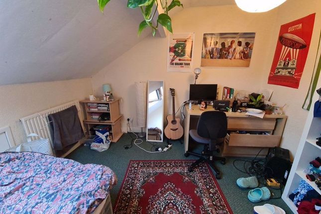 A Cozy, Well-Lit Living Room Featuring A Comfortab...