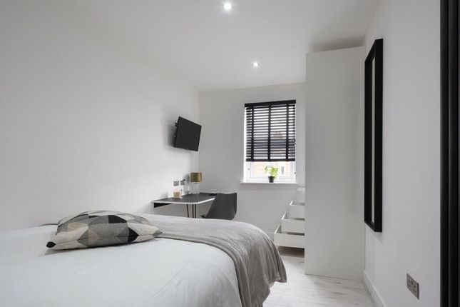 Bright And Modern Master Bedroom Featuring A Comfo...