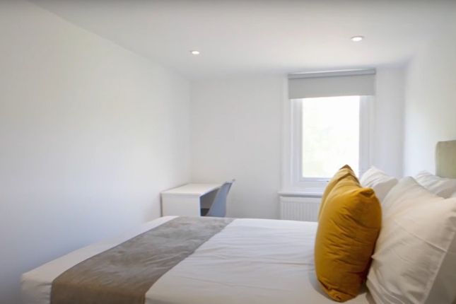 A Bright And Inviting Double Bedroom Featuring A c...