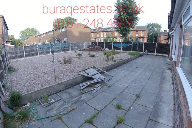 A Spacious, Sunlit Garden Area Featuring A Paved P...