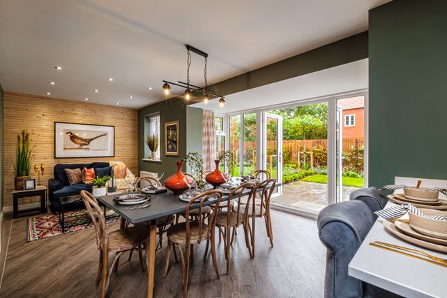 Open Plan Kitchen With Dining Table And French Doors Showing The Garden
