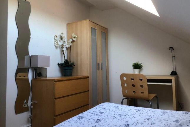 Bright And Modern Master Bedroom Featuring A Comfo...