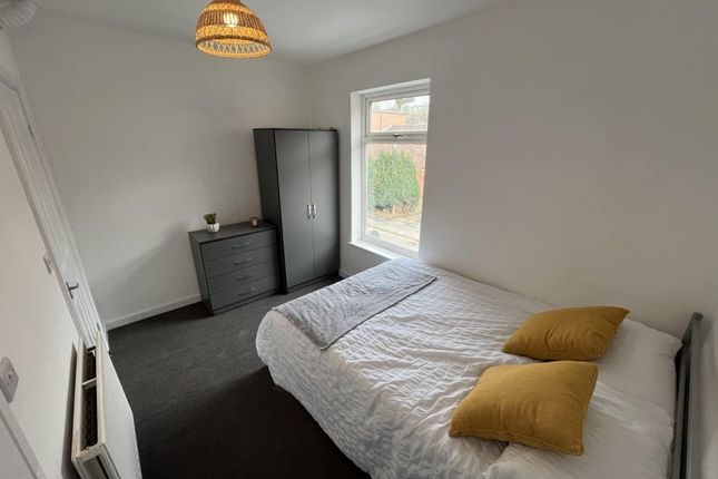 A Neat And Cozy Double Bedroom Featuring A Comfort...