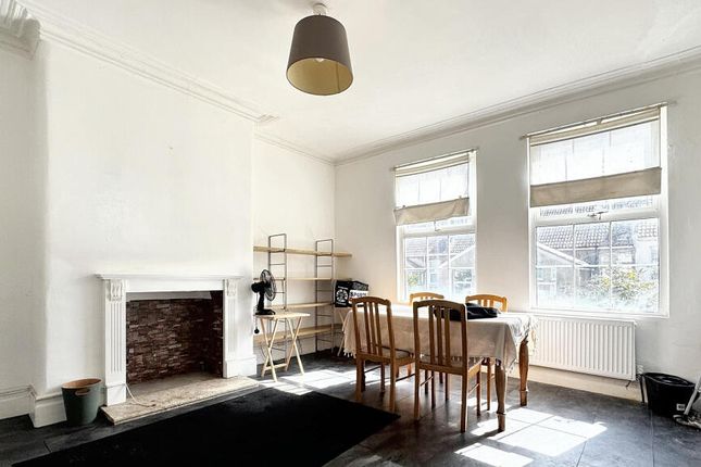 Bright And Airy Living Room With Large Windows And...