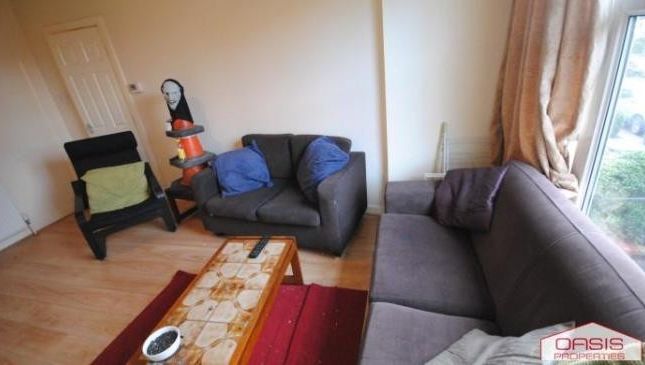 A Spacious And Inviting Living Room Filled With Na...