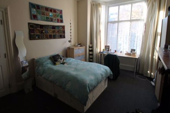 A Cozy Bedroom Featuring A Double Bed, Ample Natur...