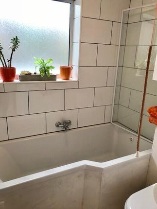 Bright And Modern Bathroom Suite Featuring A Spaci...