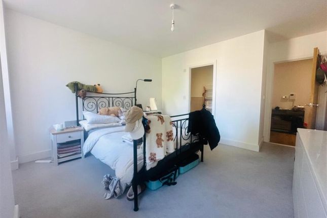 Bright And Inviting Master Bedroom Featuring A Sty...