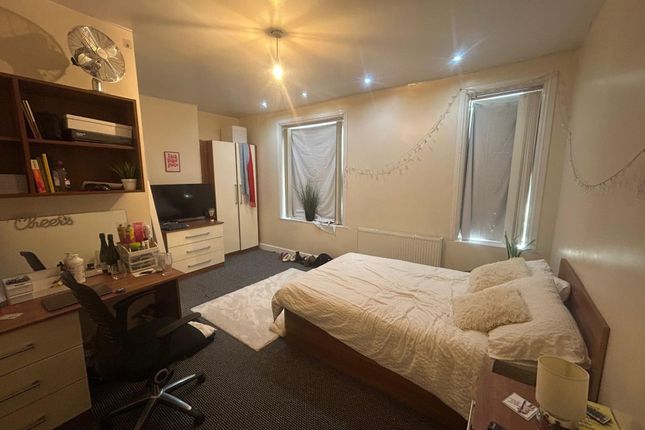 A Well-Lit Bedroom Featuring A Double Bed And A St...