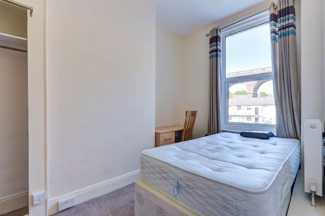 Bright Single Bedroom Featuring A Comfortable Matt...