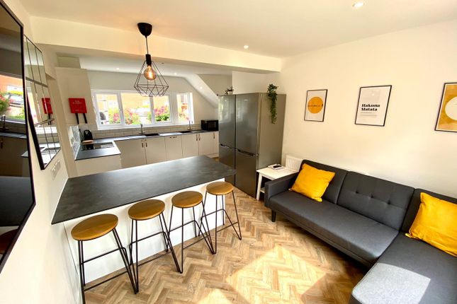 A Bright And Modern Kitchenette With Stylish Seati...