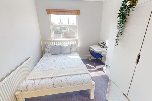 Bright And Inviting Master Bedroom Featuring A Com...