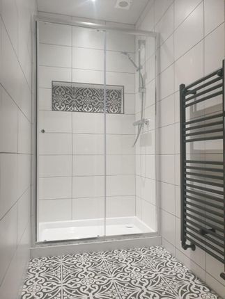 A Bright And Modern Bathroom Suite Featuring A Spa...