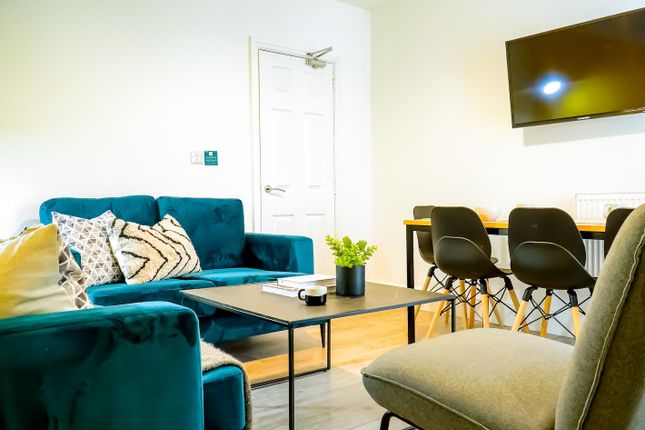 Modern And Inviting Living Room Featuring A Stylis...