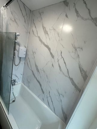 A Sleek And Modern Bathroom Suite Featuring A Clea...
