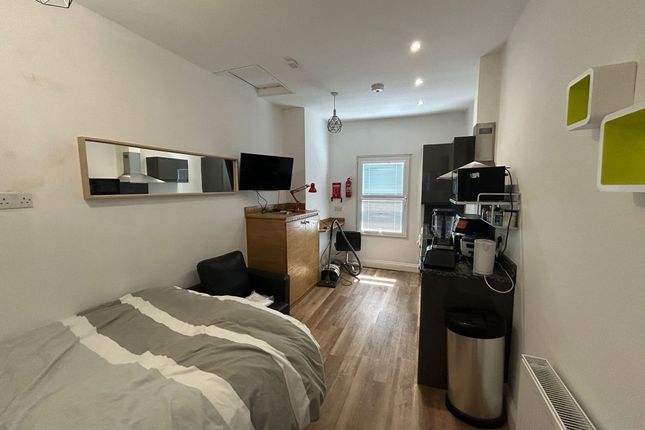 A Cozy And Neat Single Bedroom Featuring A Comfort...