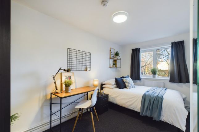 A Spacious And Bright Double Bedroom Featuring A c...
