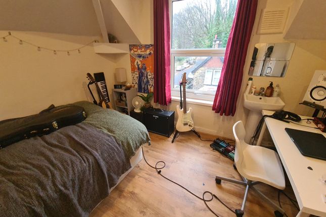 Cozy Bedroom Featuring A Comfortable Bed, A Spacio...