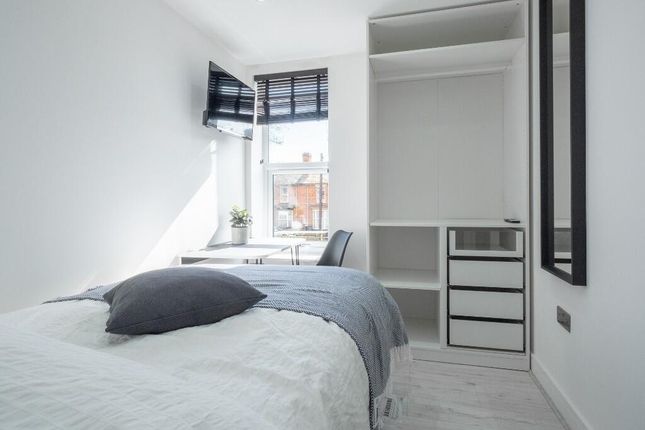 A Bright And Tidy Master Bedroom Featuring A Large...