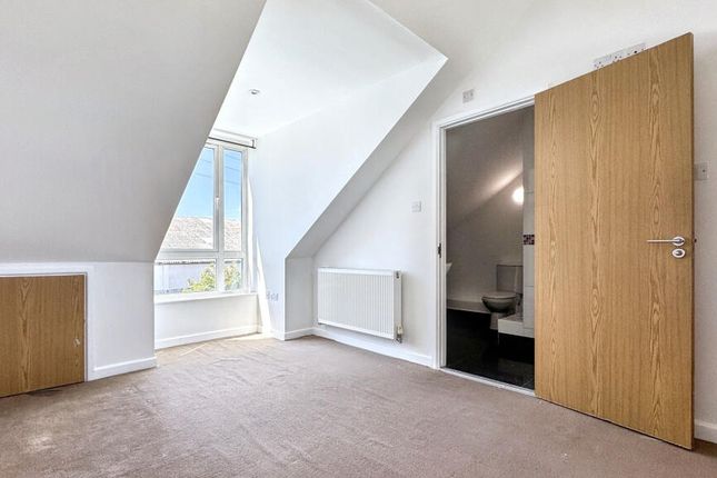 A Bright, Clean Single Bedroom Featuring A Large W...