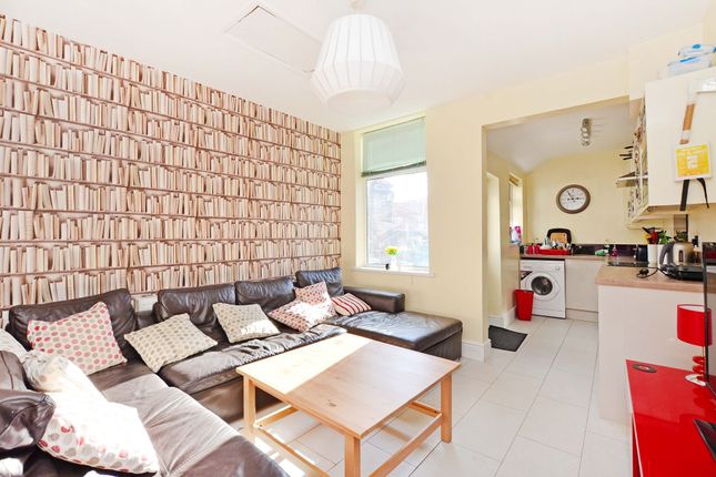 Bright And Inviting Living Room Featuring A Large ...