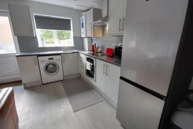 A Modern And Tidy Kitchenette Equipped With Essent...
