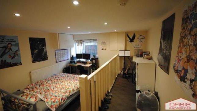 A Well-Lit Bedroom Featuring A Double Bed With Flo...