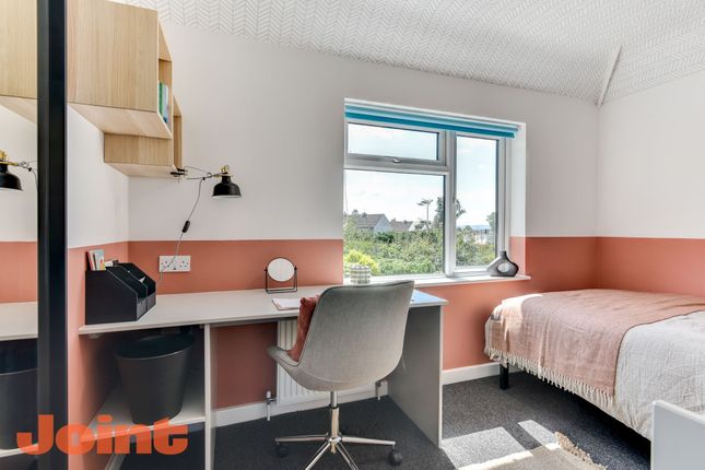 This Inviting Double Bedroom Features A Cozy Bed, ...