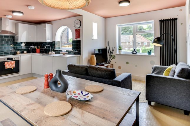 Bright And Inviting Living Room Featuring A Stylis...