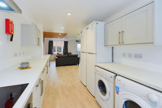 A Spacious And Modern Kitchenette With Ample Stora...